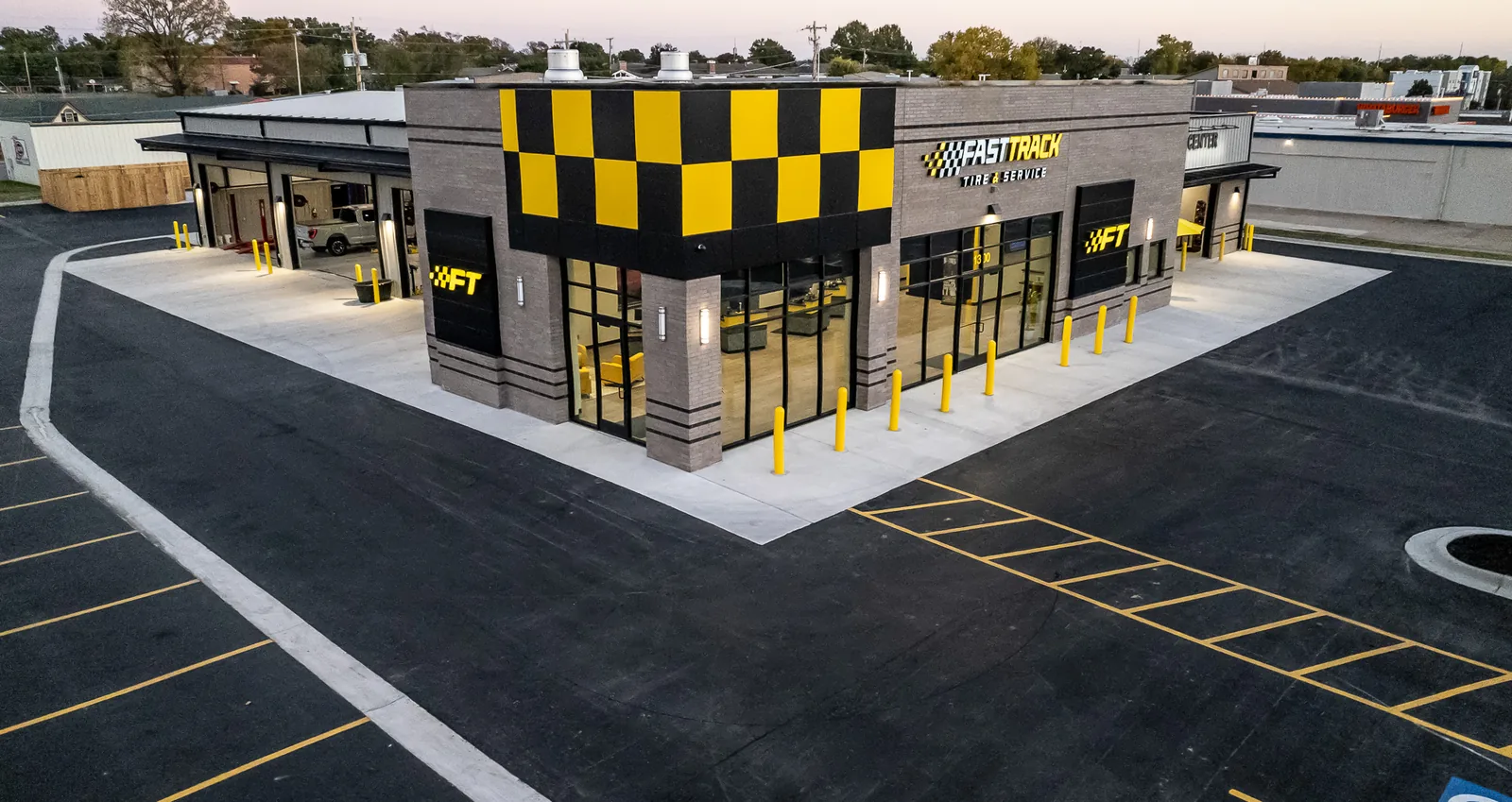 Aerial view of the Fast Track Tire and Service Highway 75 location at dusk