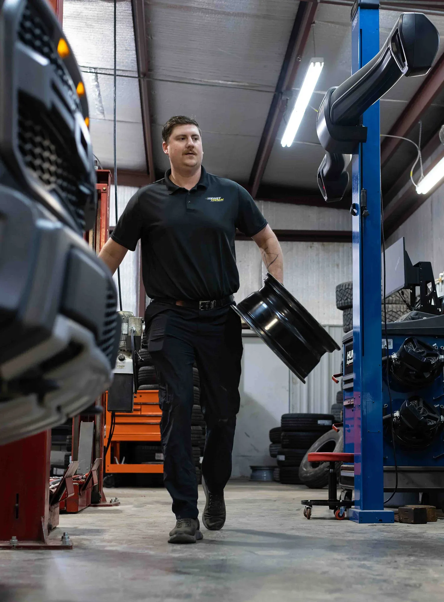 Technician inspecting vehicle